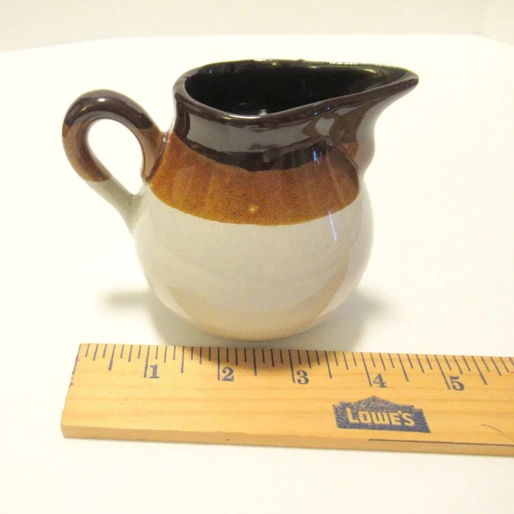 Brown and White Ceramic Serveware Pitcher